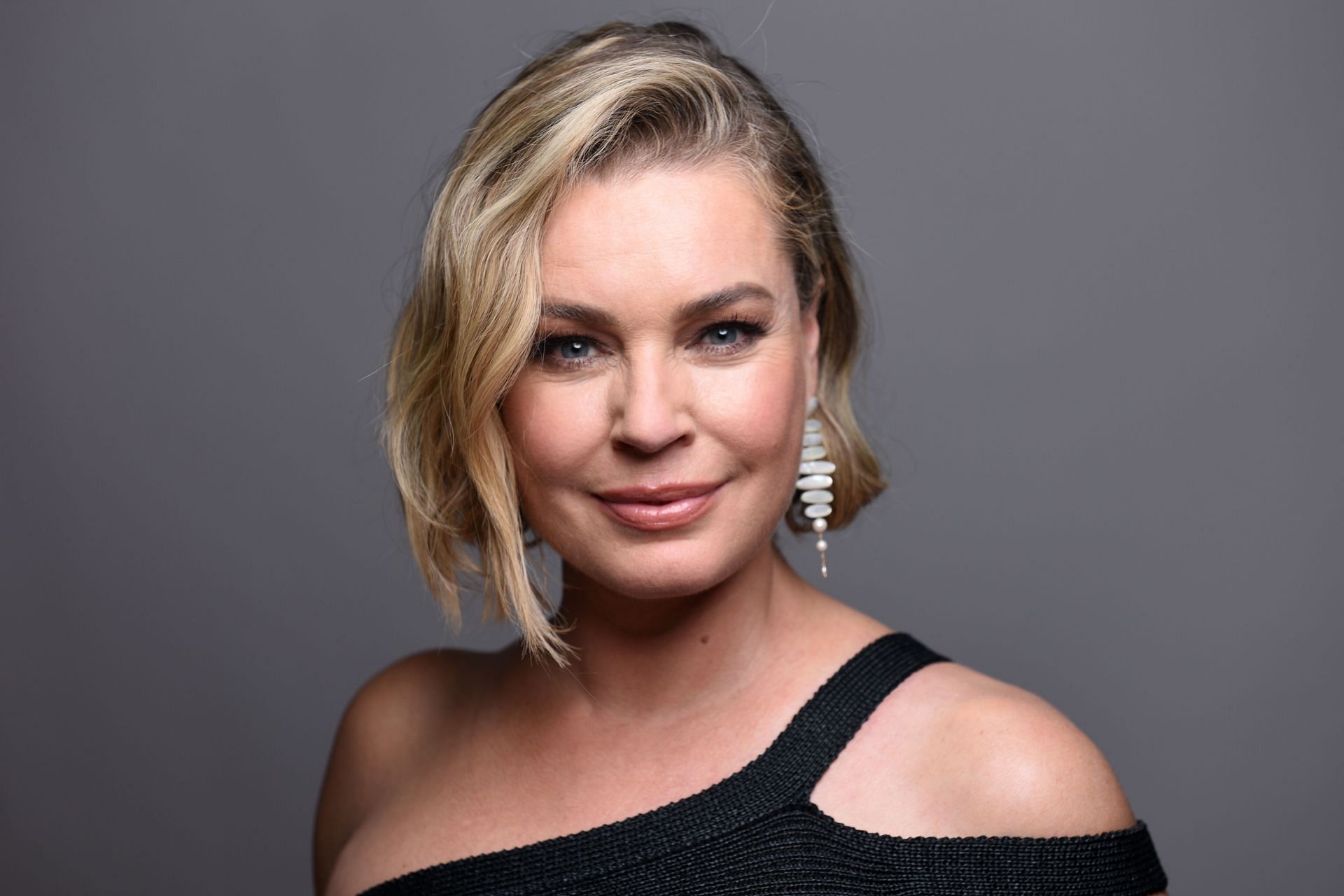 Rebecca Romijn poses in the IMDboat Exclusive Portrait Studio at San Diego Comic-Con 2024 (Image via Getty)